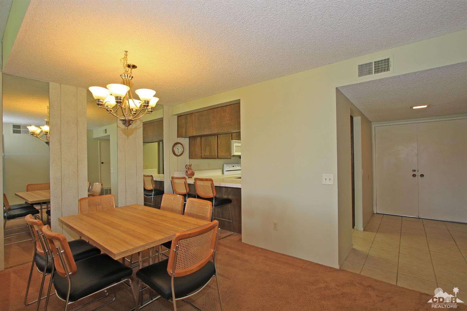 7 Palma Drive Rancho Mirage, CA 92270 - Photo 16 of 33 a dining room with a table and chairs