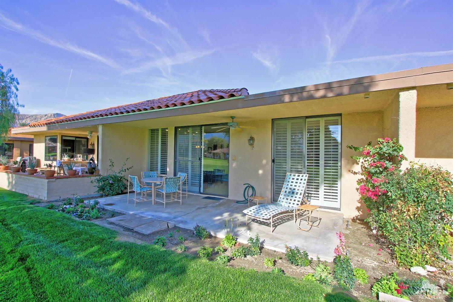 7 Palma Drive Rancho Mirage, CA 92270 - Photo 3 of 33 a front view of a house with garden