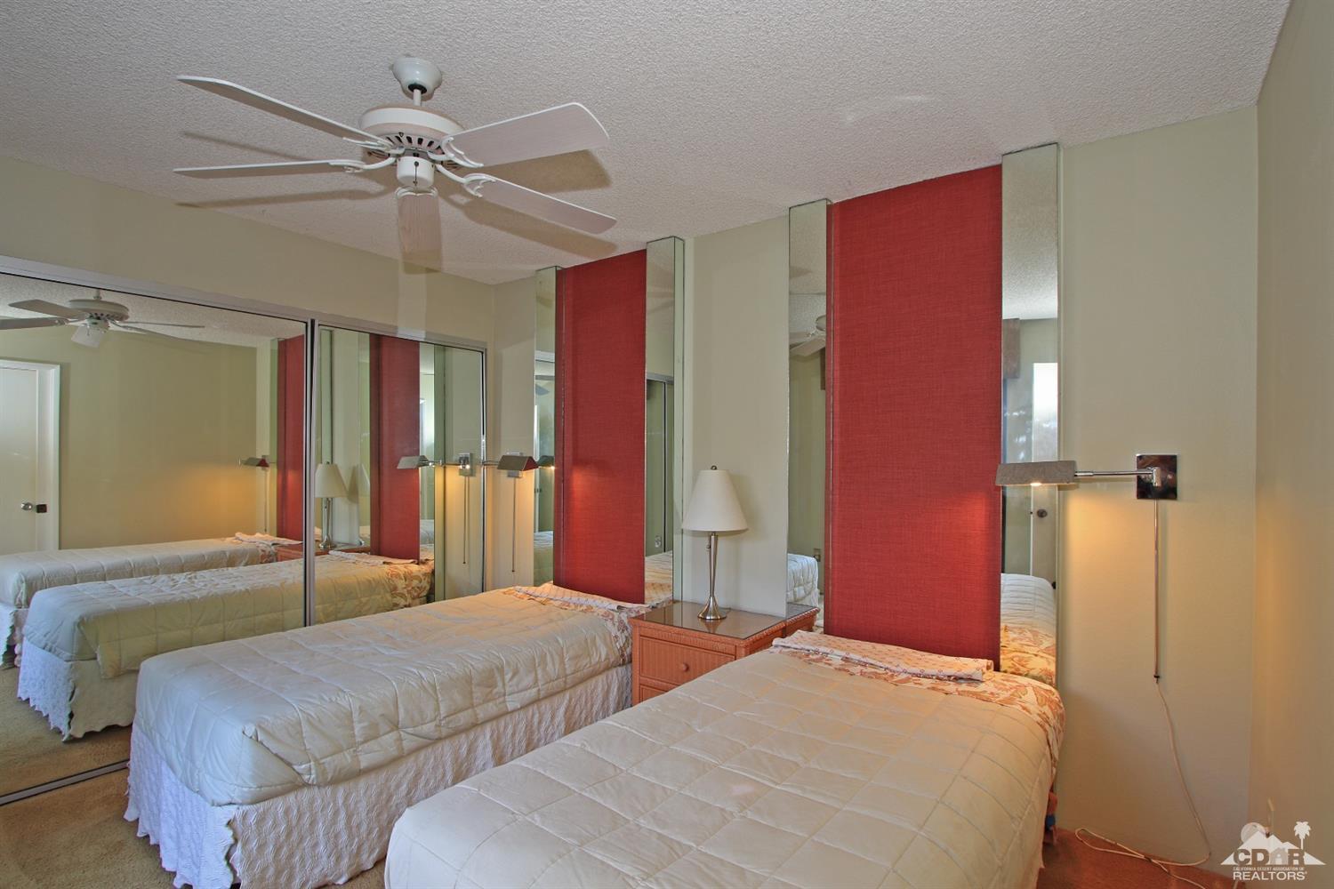 7 Palma Drive Rancho Mirage, CA 92270 - Photo 26 of 33 a bedroom with bed and wooden floor