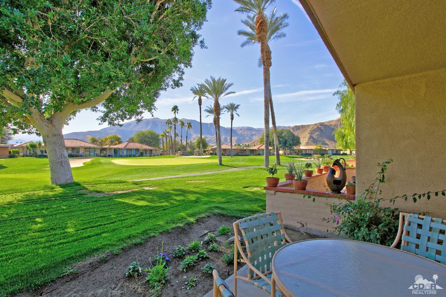 7 Palma Drive Rancho Mirage, CA 92270 - Photo 32 of 33 a view of a table and chairs in the garden