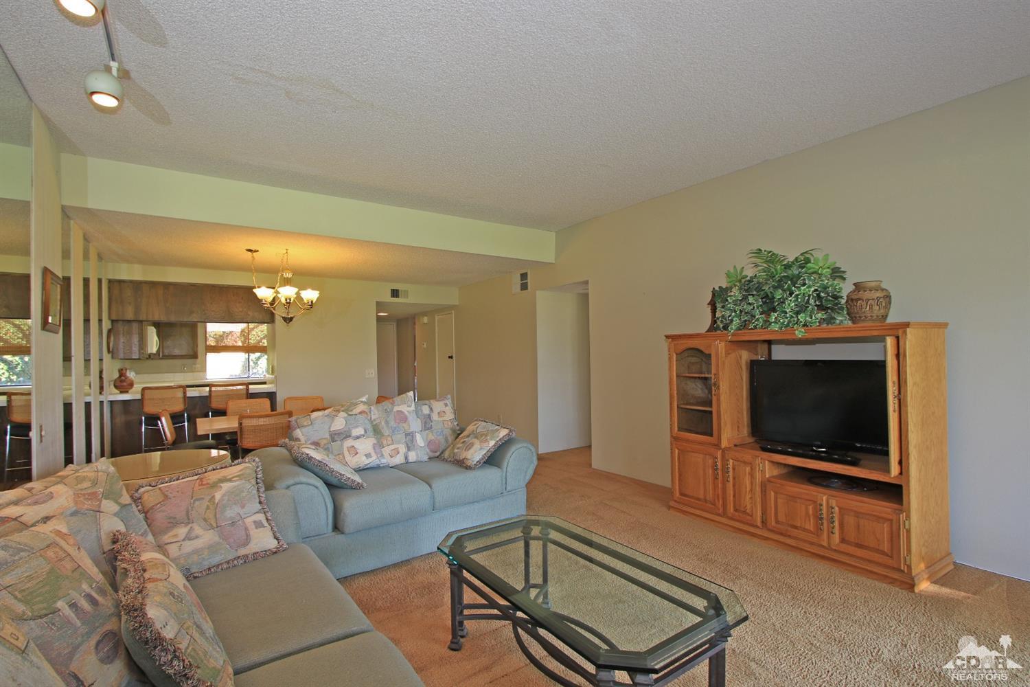 7 Palma Drive Rancho Mirage, CA 92270 - Photo 9 of 33 a living room with furniture and a flat screen tv