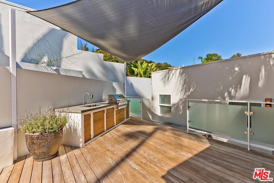 2203 Bowmont Drive Beverly Hills, CA 90210 - Photo 20 of 21 a view of balcony with a potted plant