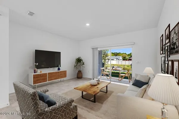 a view of kitchen with sink microwave and refrigerator