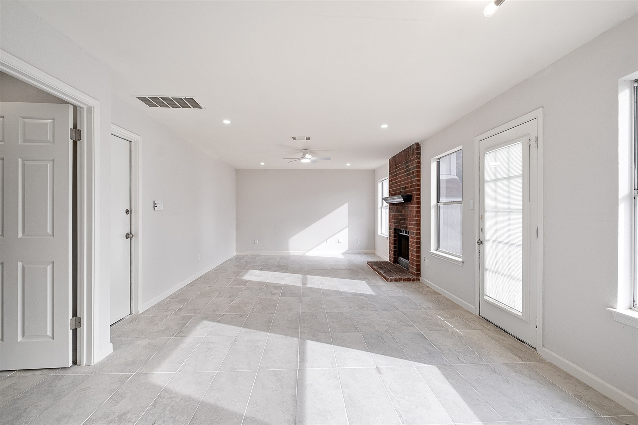 518 Tanner Trail Pflugerville, TX 78660 - Photo 10 of 32 a view of a big room with windows and cabinet