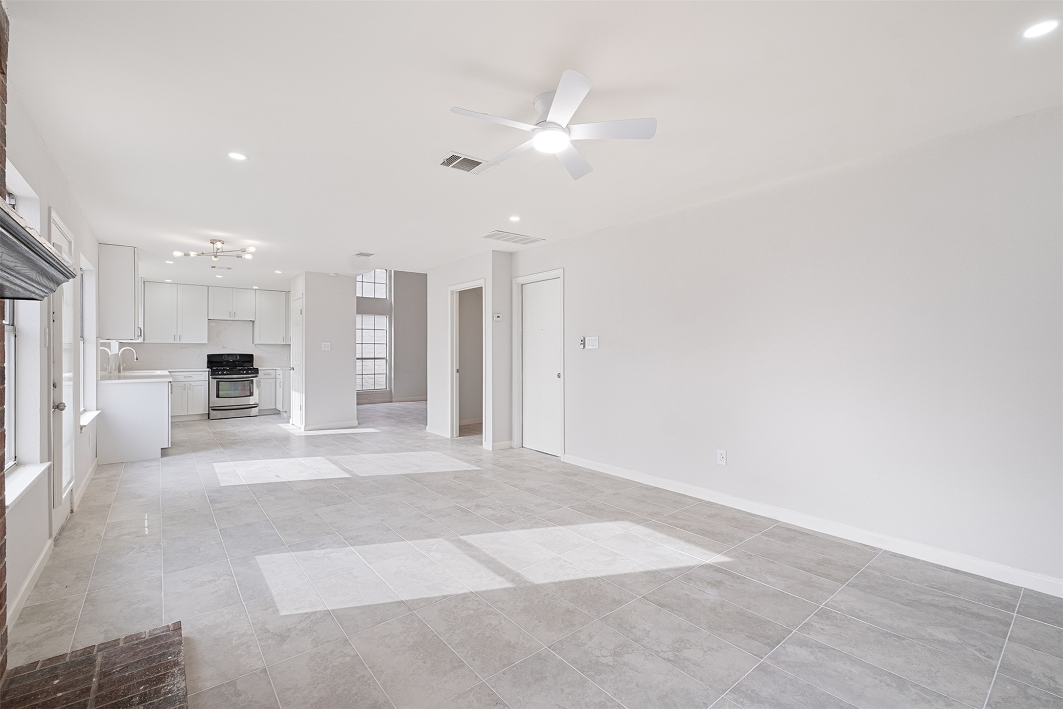 518 Tanner Trail Pflugerville, TX 78660 - Photo 13 of 32 a view of a kitchen with a sink and a large window