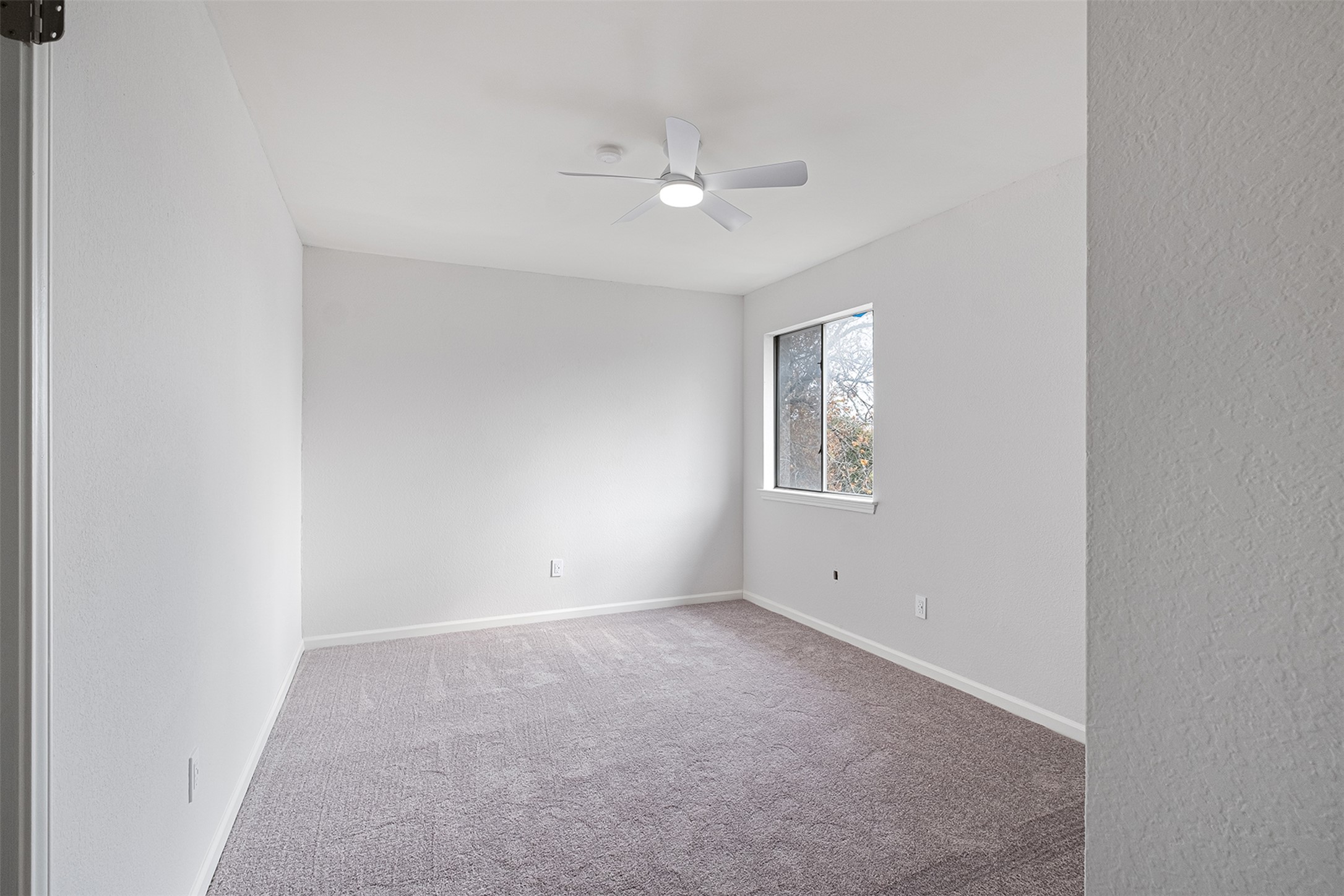 518 Tanner Trail Pflugerville, TX 78660 - Photo 20 of 32 an empty room with a windows and ceiling fan