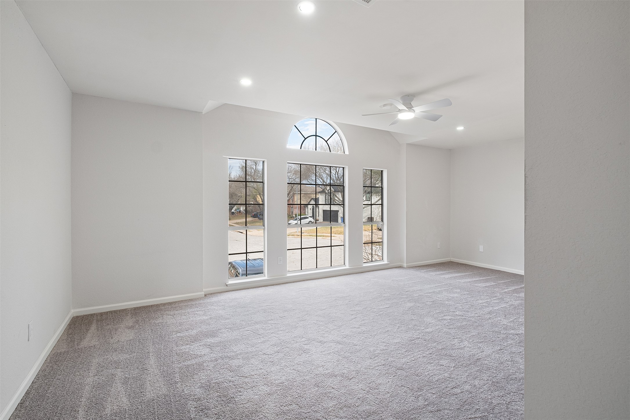 518 Tanner Trail Pflugerville, TX 78660 - Photo 22 of 32 an empty room with windows and ceiling fan