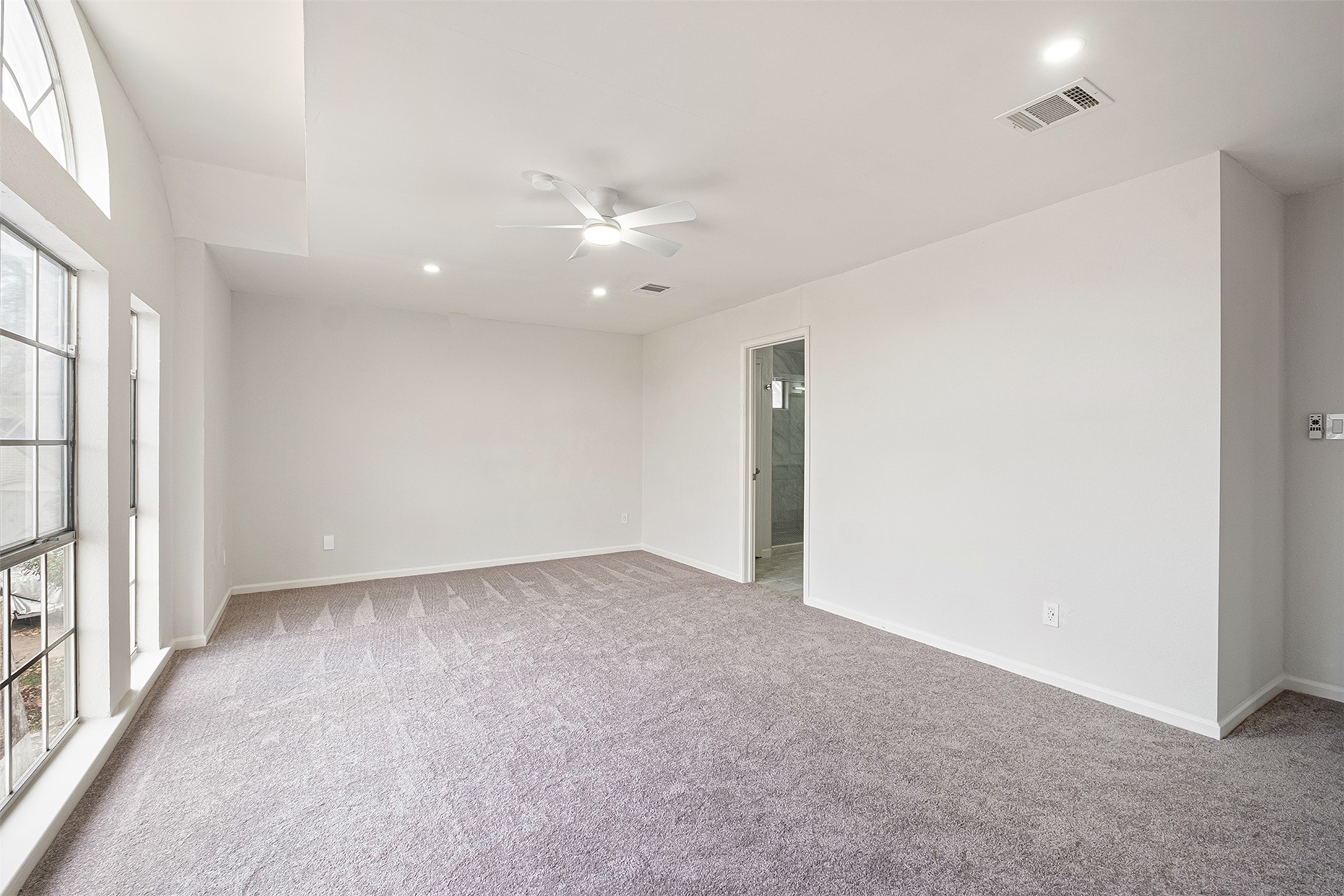 518 Tanner Trail Pflugerville, TX 78660 - Photo 23 of 32 an empty room with a ceiling fan and a window