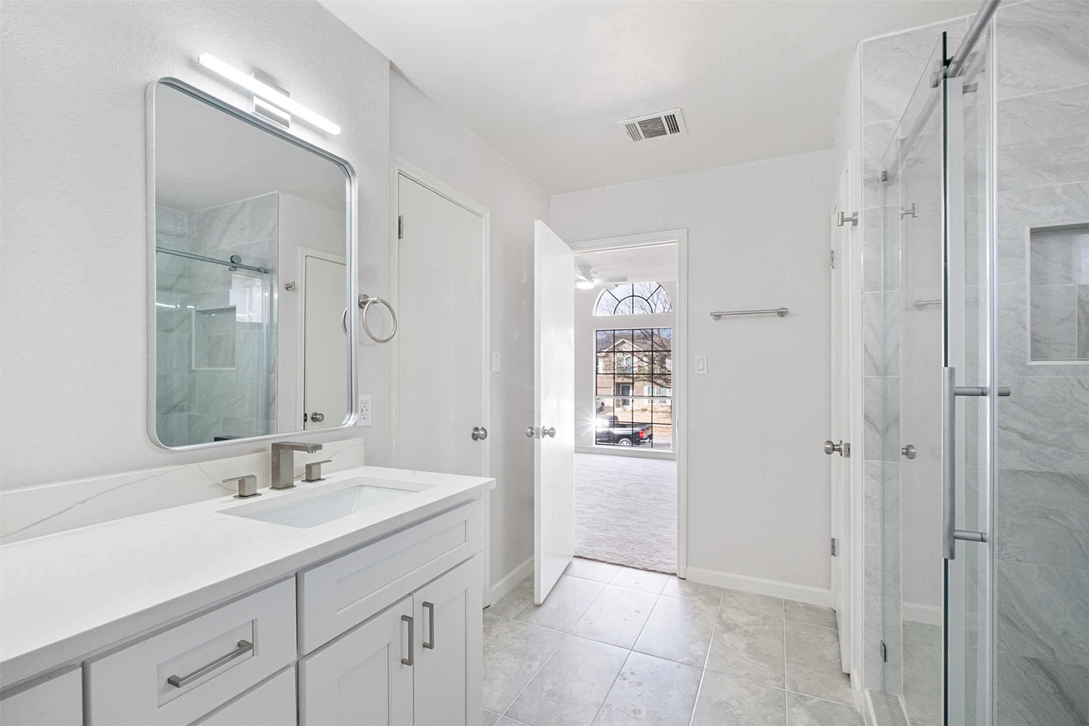 518 Tanner Trail Pflugerville, TX 78660 - Photo 28 of 32 a bathroom with a shower sink and mirror