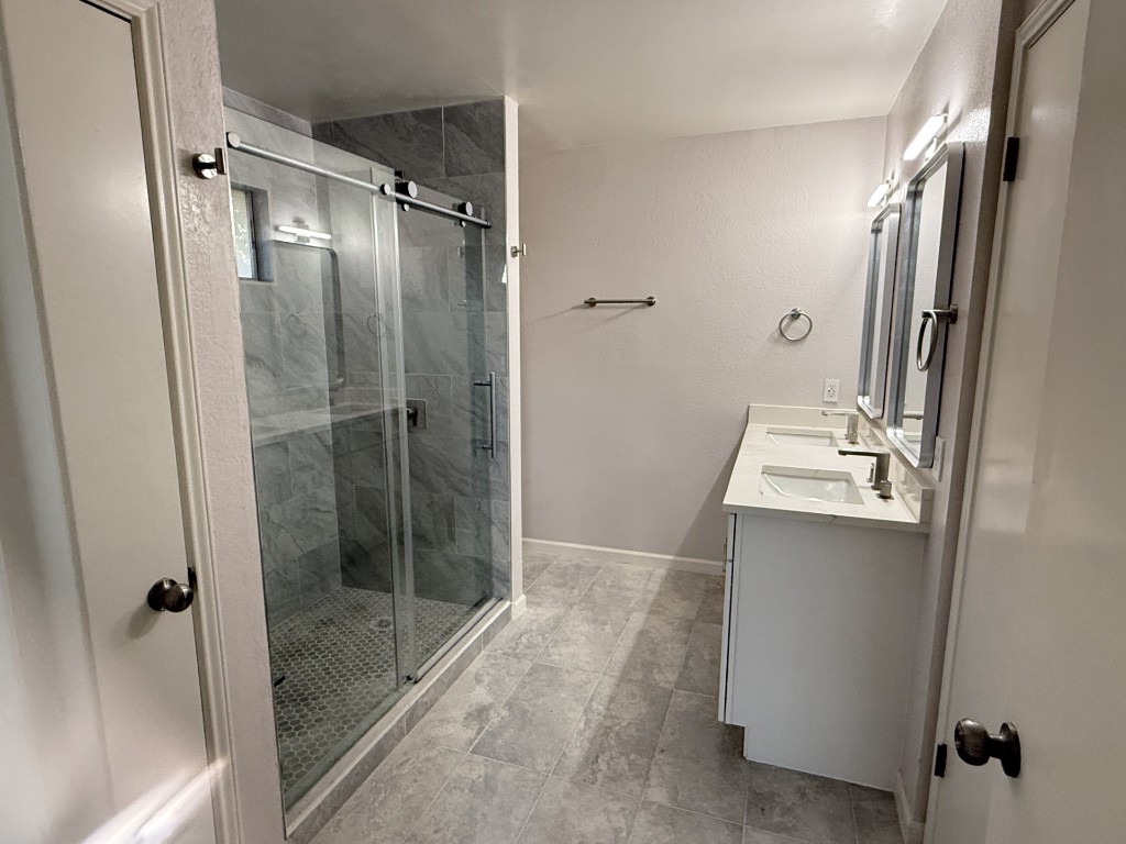 518 Tanner Trail Pflugerville, TX 78660 - Photo 5 of 7 a bathroom with a shower and a sink