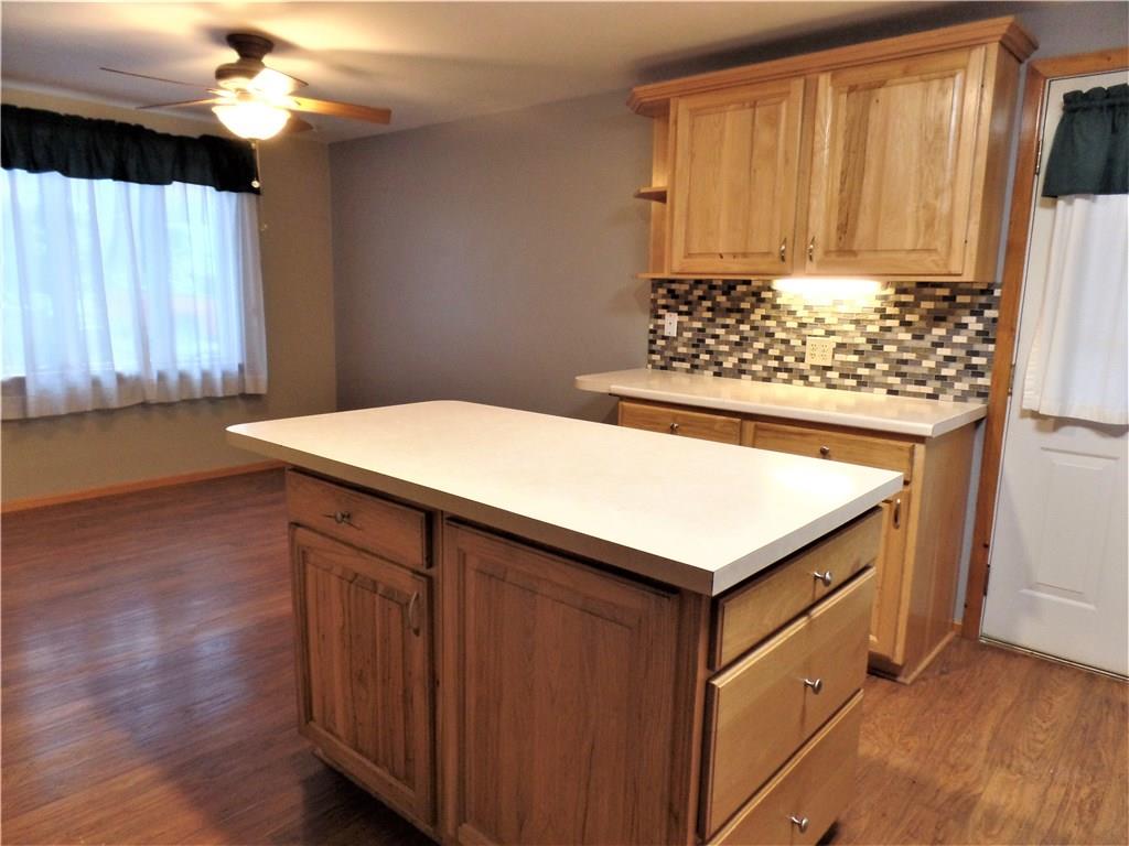1106 Jacks Run Road North Versailles, PA 15137 - Photo 22 of 25 DINING AREA VIEW OF KITCHEN & MORE SEATING AT THE CENTER ISLAND