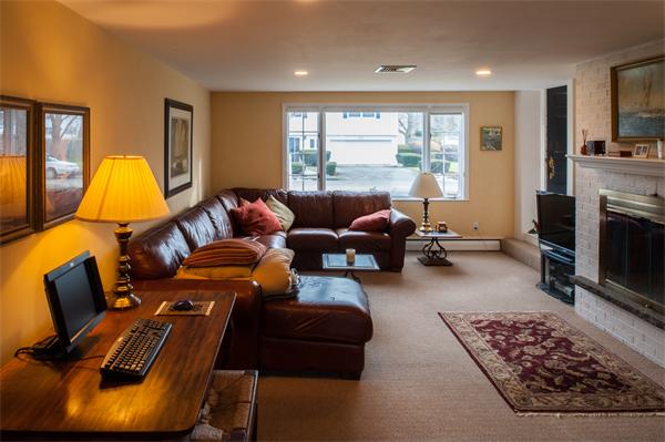 4 Buchanan Road Marblehead, MA 01945 - Photo 6 of 11 a living room with furniture fireplace and a large window