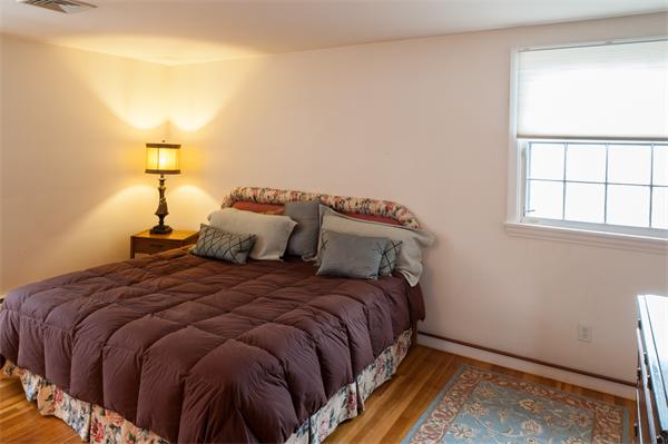 4 Buchanan Road Marblehead, MA 01945 - Photo 9 of 11 a bedroom with a bed and a window