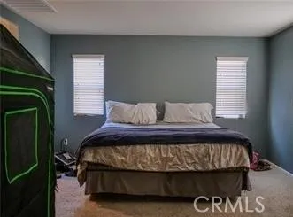 a kitchen with stainless steel appliances granite countertop a table chairs sink refrigerator and microwave