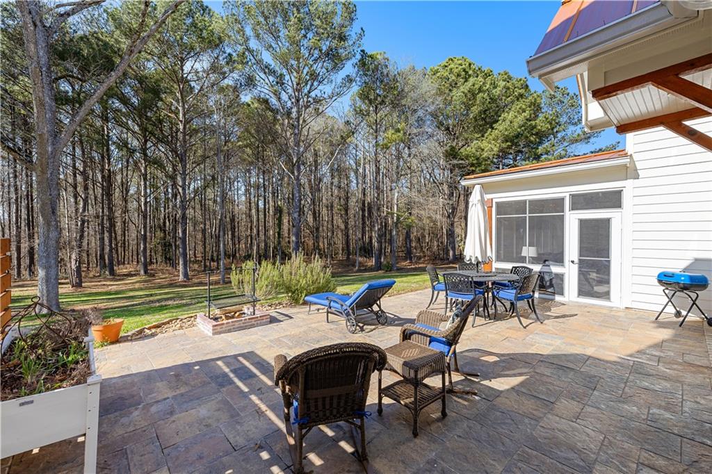619 Old Greenville Road Fayetteville, GA 30215 - Photo 104 of 107 a view of swimming pool with outdoor seating and a tree