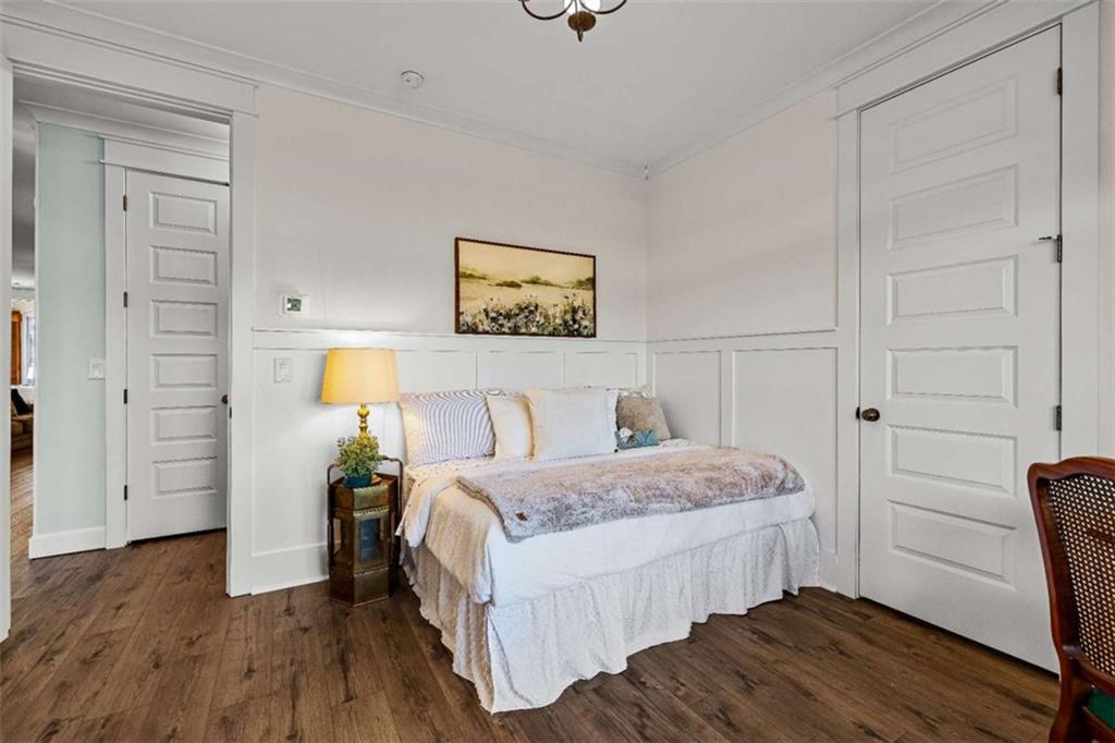 619 Old Greenville Road Fayetteville, GA 30215 - Photo 15 of 107 a bedroom with a bed and a lamp on dresser