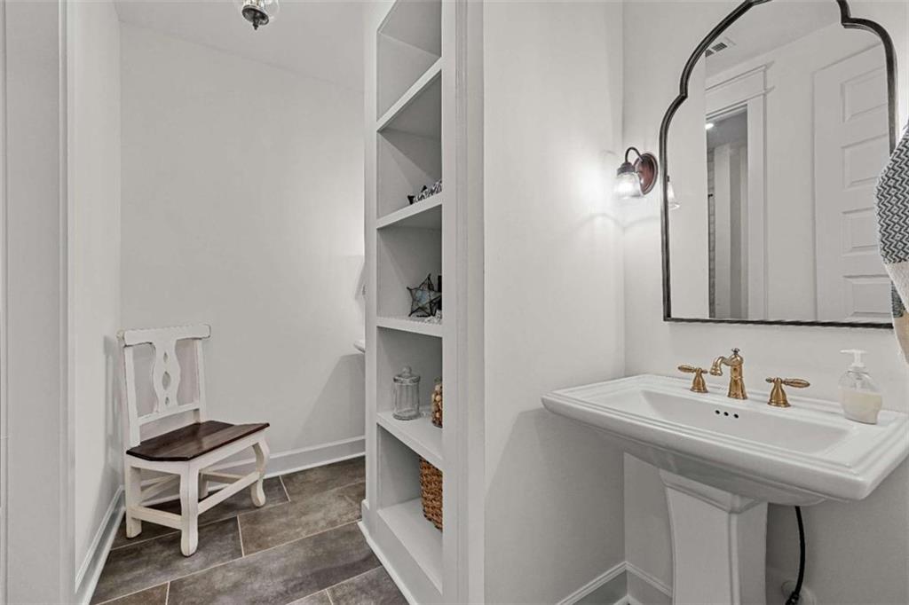 619 Old Greenville Road Fayetteville, GA 30215 - Photo 17 of 107 a bathroom with a sink and a mirror