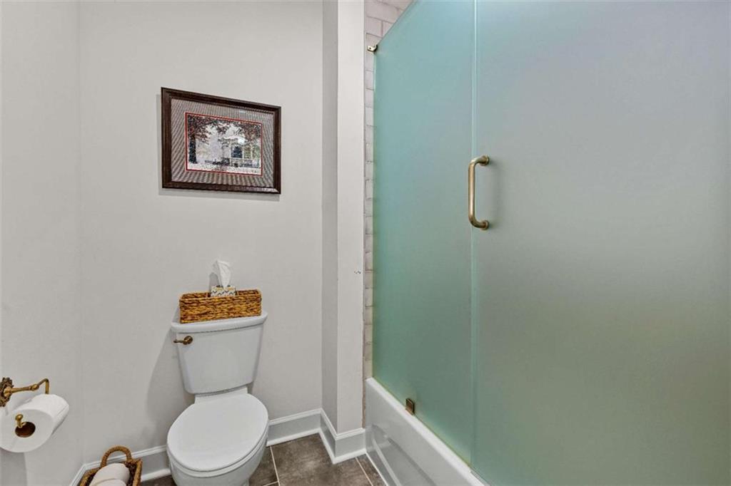 619 Old Greenville Road Fayetteville, GA 30215 - Photo 19 of 107 a white toilet sitting next to a bathroom sink