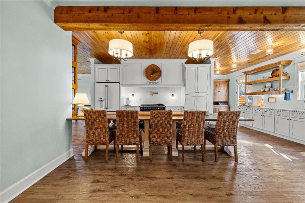 619 Old Greenville Road Fayetteville, GA 30215 - Photo 2 of 107 a dining room with furniture and wooden floor