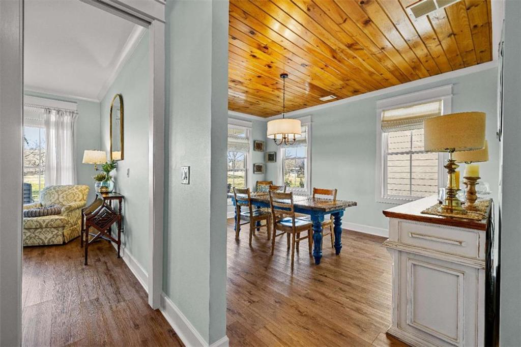 619 Old Greenville Road Fayetteville, GA 30215 - Photo 33 of 107 a view of a dining room with furniture and wooden floor