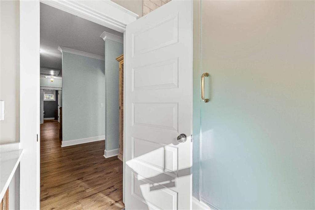 619 Old Greenville Road Fayetteville, GA 30215 - Photo 44 of 107 a view of a hallway with wooden floor and staircase