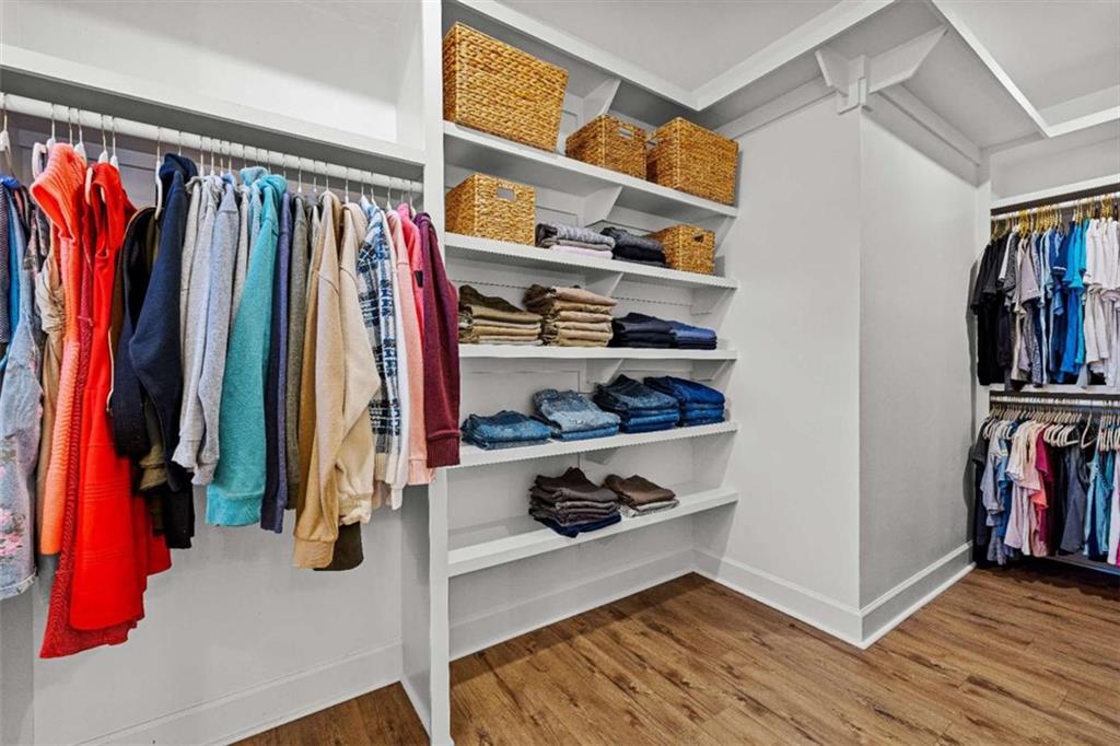 619 Old Greenville Road Fayetteville, GA 30215 - Photo 53 of 107 a view of walk in closet with clothes and shoes