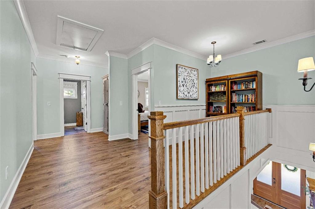 619 Old Greenville Road Fayetteville, GA 30215 - Photo 60 of 107 a view of a hallway with wooden floor and windows