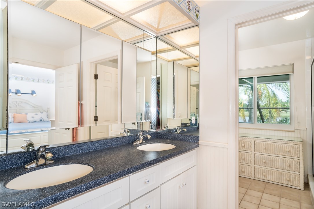 1031 Sand Castle Road Sanibel, FL 33957 - Photo 11 of 27 a bathroom with a sink double vanity and a mirror