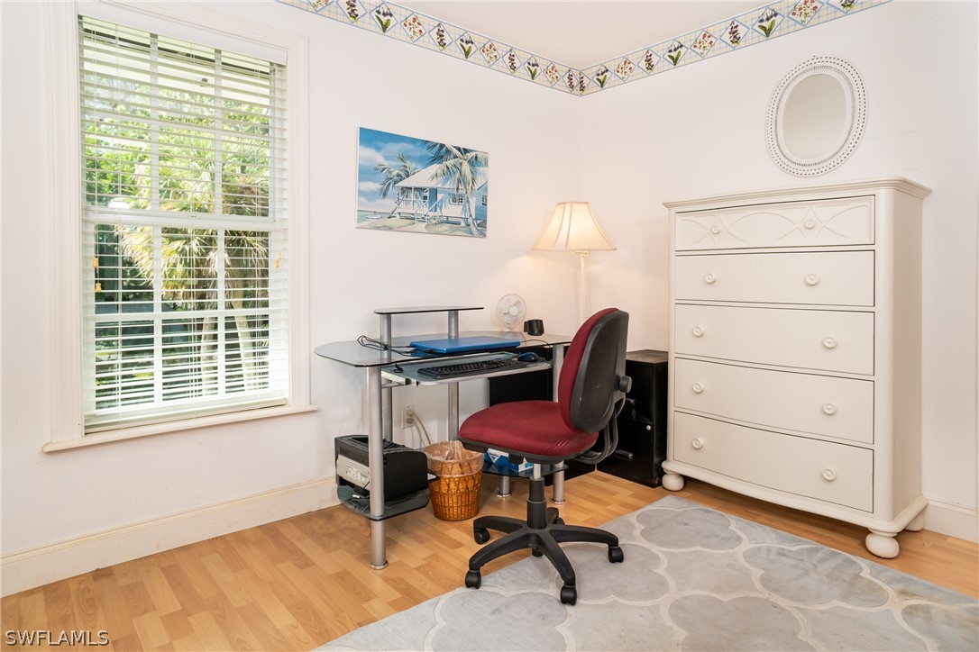 1031 Sand Castle Road Sanibel, FL 33957 - Photo 12 of 27 a workspace with furniture and a window