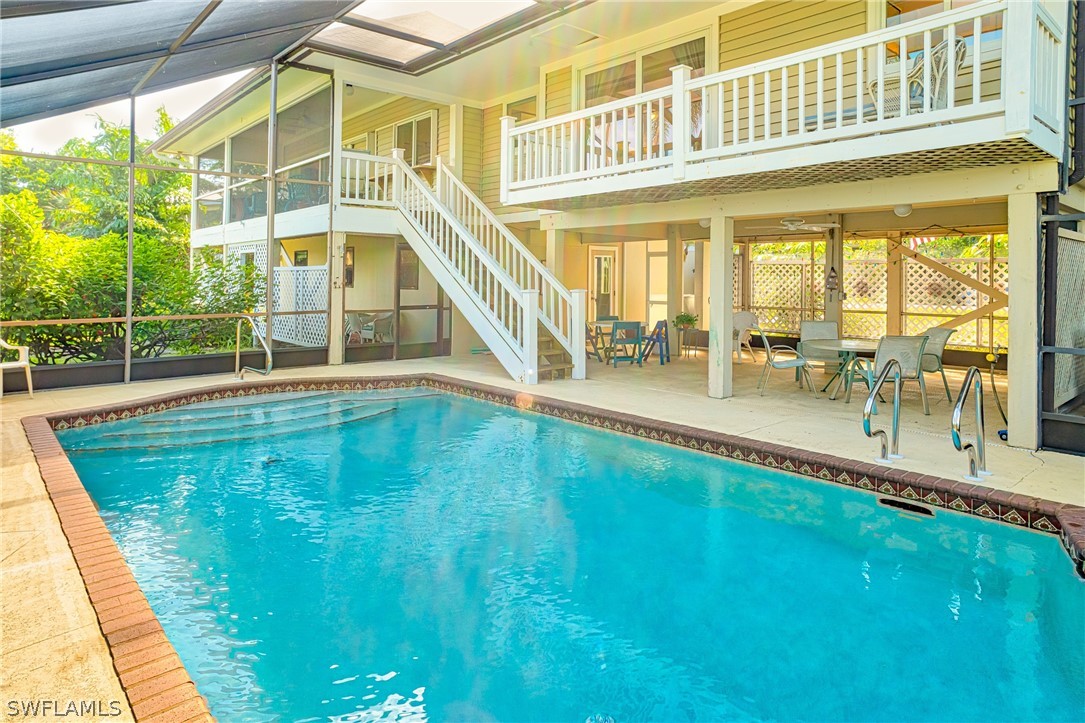 1031 Sand Castle Road Sanibel, FL 33957 - Photo 18 of 27 a view of a swimming pool with a patio