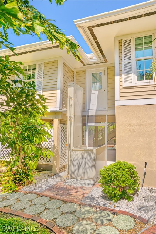 1031 Sand Castle Road Sanibel, FL 33957 - Photo 20 of 27 a front view of a house with a yard