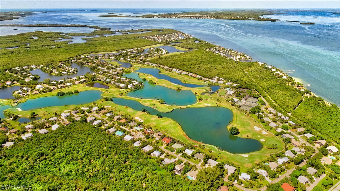 1031 Sand Castle Road Sanibel, FL 33957 - Photo 27 of 27 a view of an ocean and a building