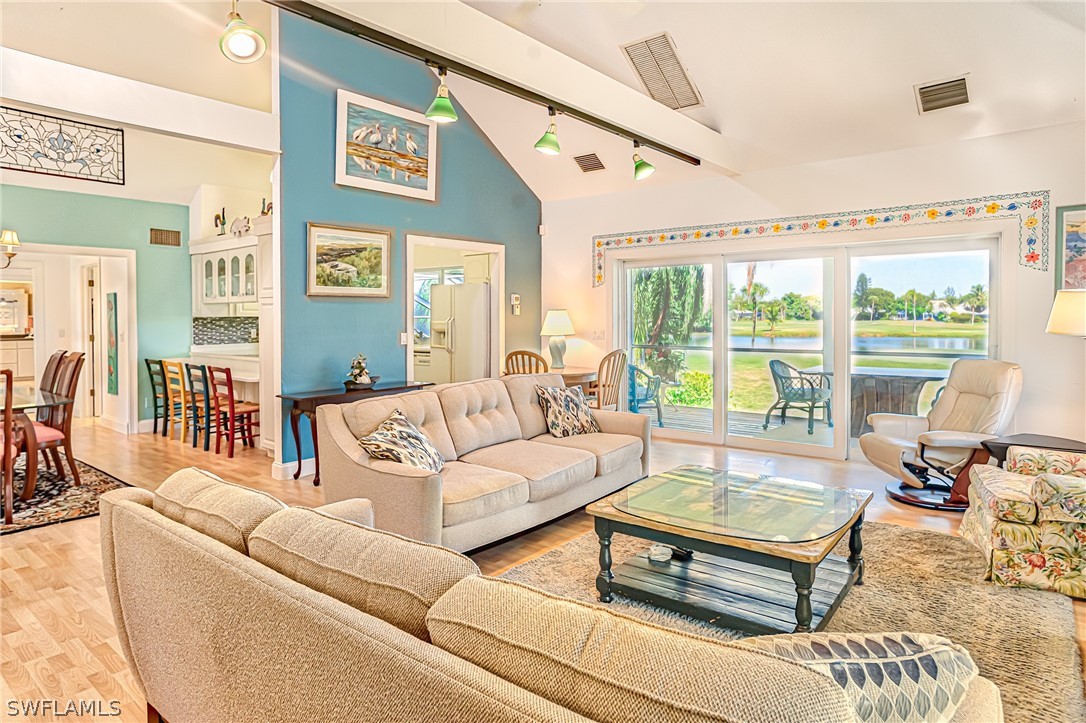 1031 Sand Castle Road Sanibel, FL 33957 - Photo 3 of 27 a living room with furniture and a large window