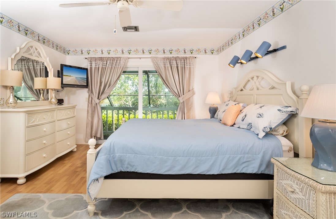 1031 Sand Castle Road Sanibel, FL 33957 - Photo 10 of 27 a bedroom with a bed window and a dresser