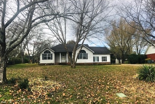 2306 Riverstone Drive Murfreesboro, TN 37128 - Photo 2 of 18 a front view of a house with a garden