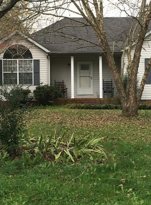 2306 Riverstone Drive Murfreesboro, TN 37128 - Photo 3 of 18 front view of a house with a yard