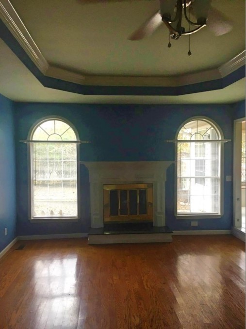 2306 Riverstone Drive Murfreesboro, TN 37128 - Photo 4 of 18 a view of an empty room with wooden floor and a window