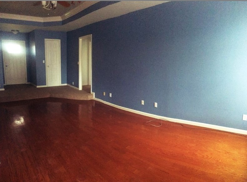 2306 Riverstone Drive Murfreesboro, TN 37128 - Photo 5 of 18 an empty room with wooden floor and windows