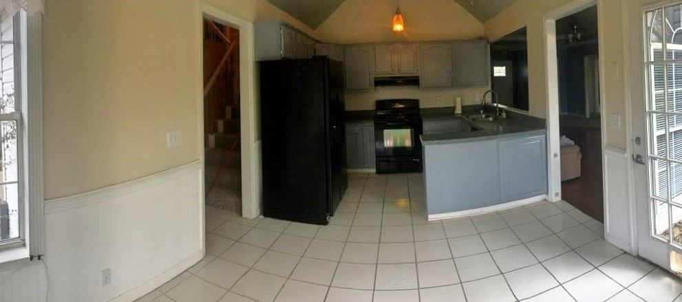 2306 Riverstone Drive Murfreesboro, TN 37128 - Photo 7 of 18 a kitchen with a refrigerator and a stove