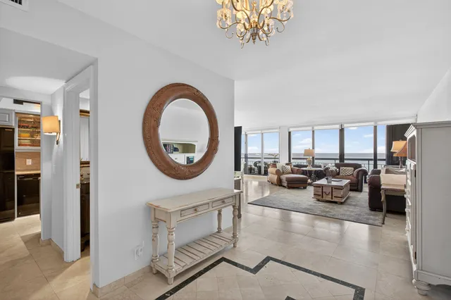 a bathroom with a glass shower door a sink and a mirror