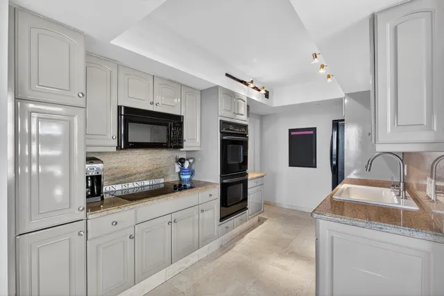 a bathroom with a shower and a sink