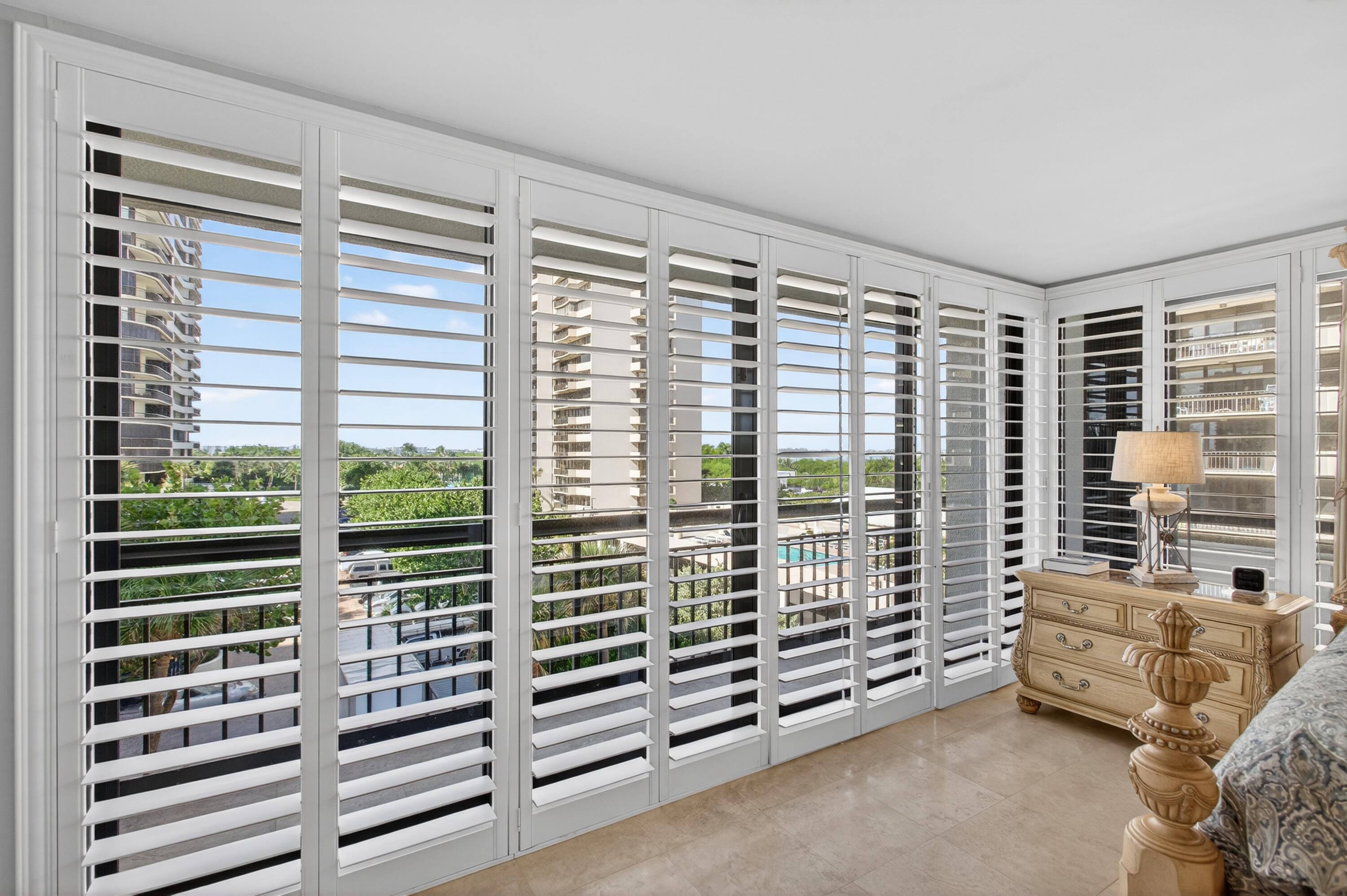 4050 North Ocean Drive, Unit 301 Riviera Beach, FL 33404 - Photo 23 of 62 a view of a bedroom with furniture and windows