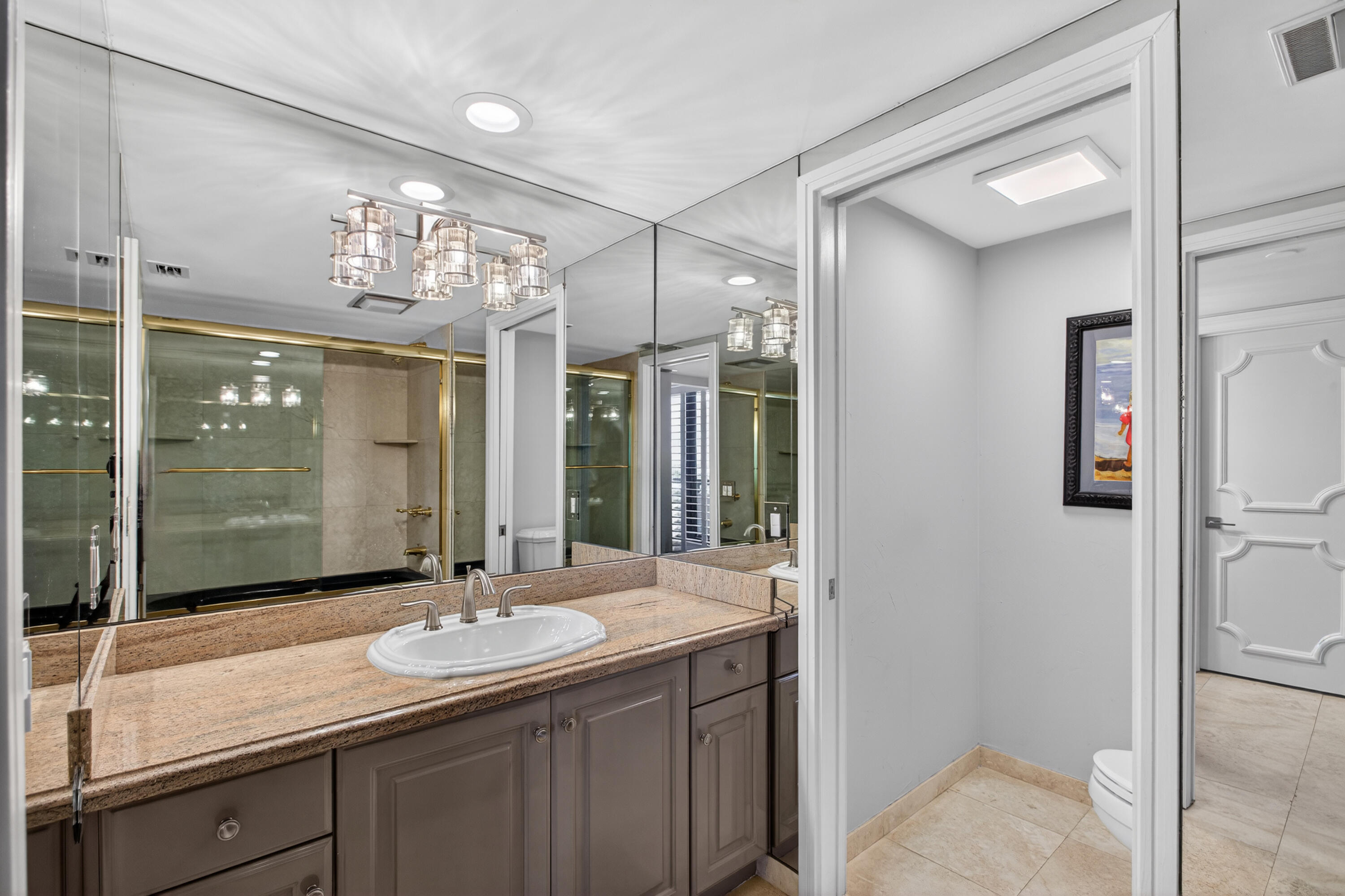 4050 North Ocean Drive, Unit 301 Riviera Beach, FL 33404 - Photo 39 of 62 a bathroom with a sink shower and a mirror