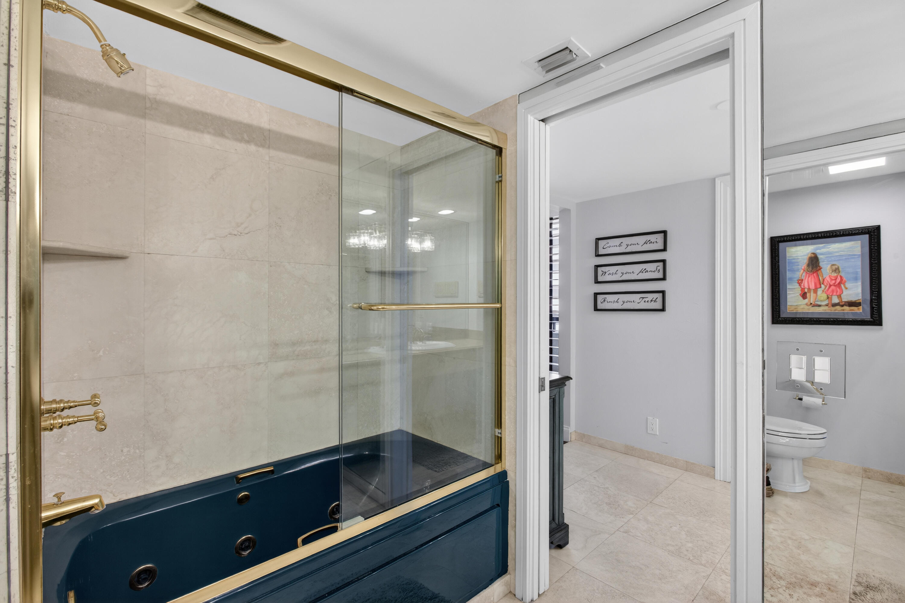 4050 North Ocean Drive, Unit 301 Riviera Beach, FL 33404 - Photo 40 of 62 a bathroom with a bathtub and a shower