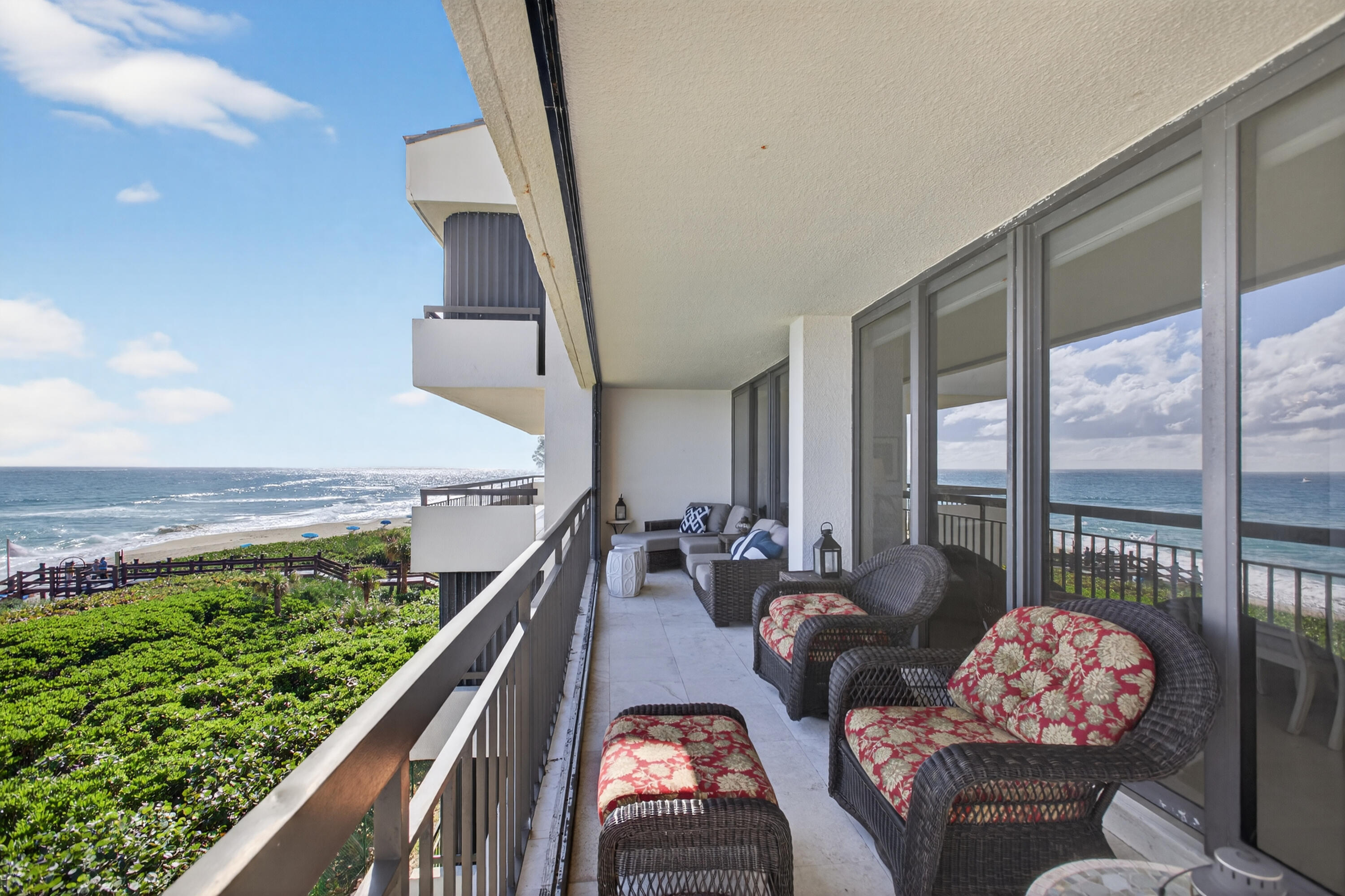 4050 North Ocean Drive, Unit 301 Riviera Beach, FL 33404 - Photo 49 of 62 a living room with furniture and flowers