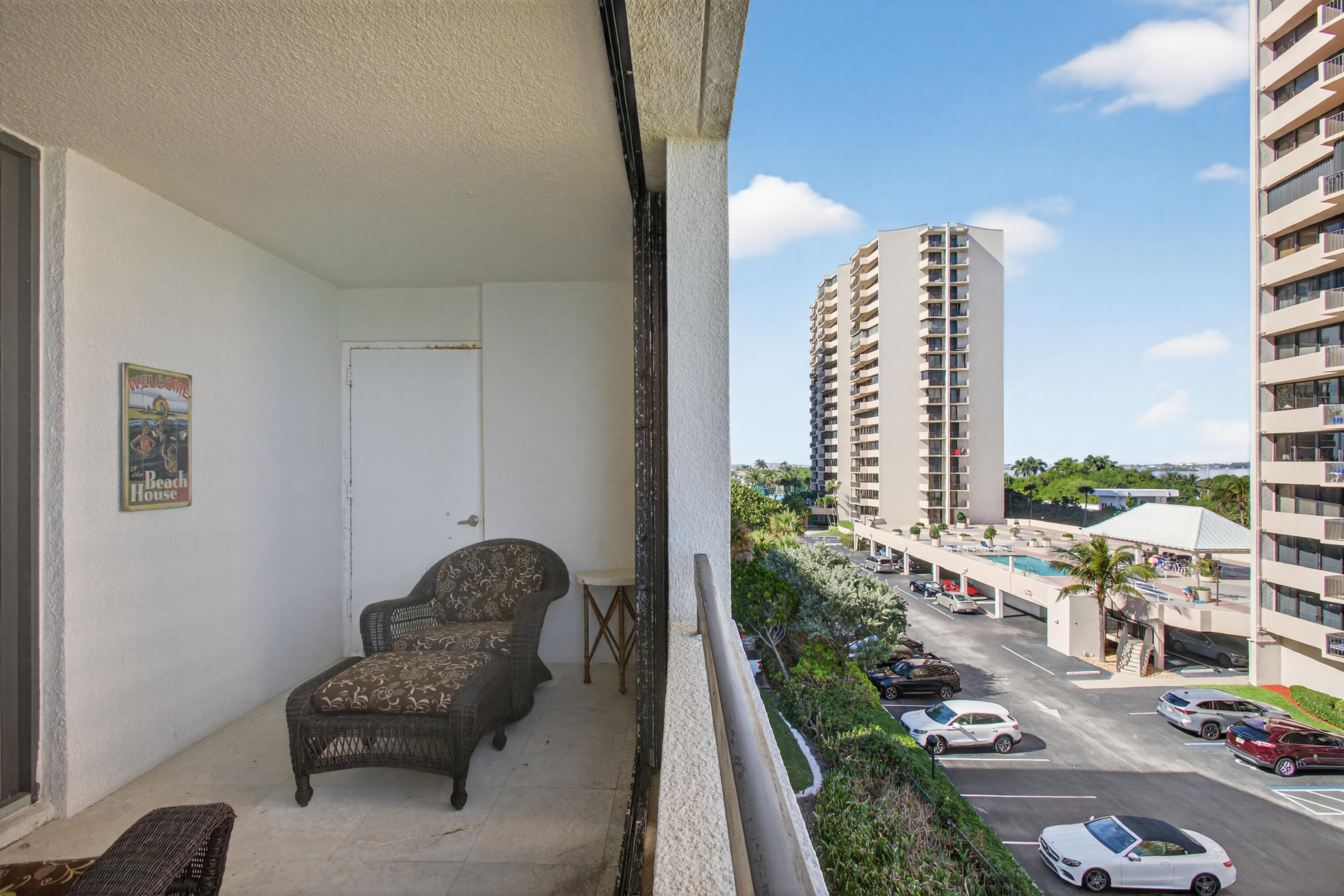 4050 North Ocean Drive, Unit 301 Riviera Beach, FL 33404 - Photo 50 of 62 a living room with furniture and a floor to ceiling window