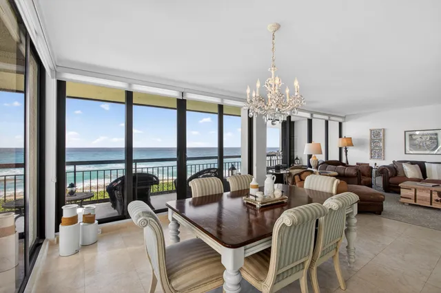 a view of a livingroom with furniture and a chandelier