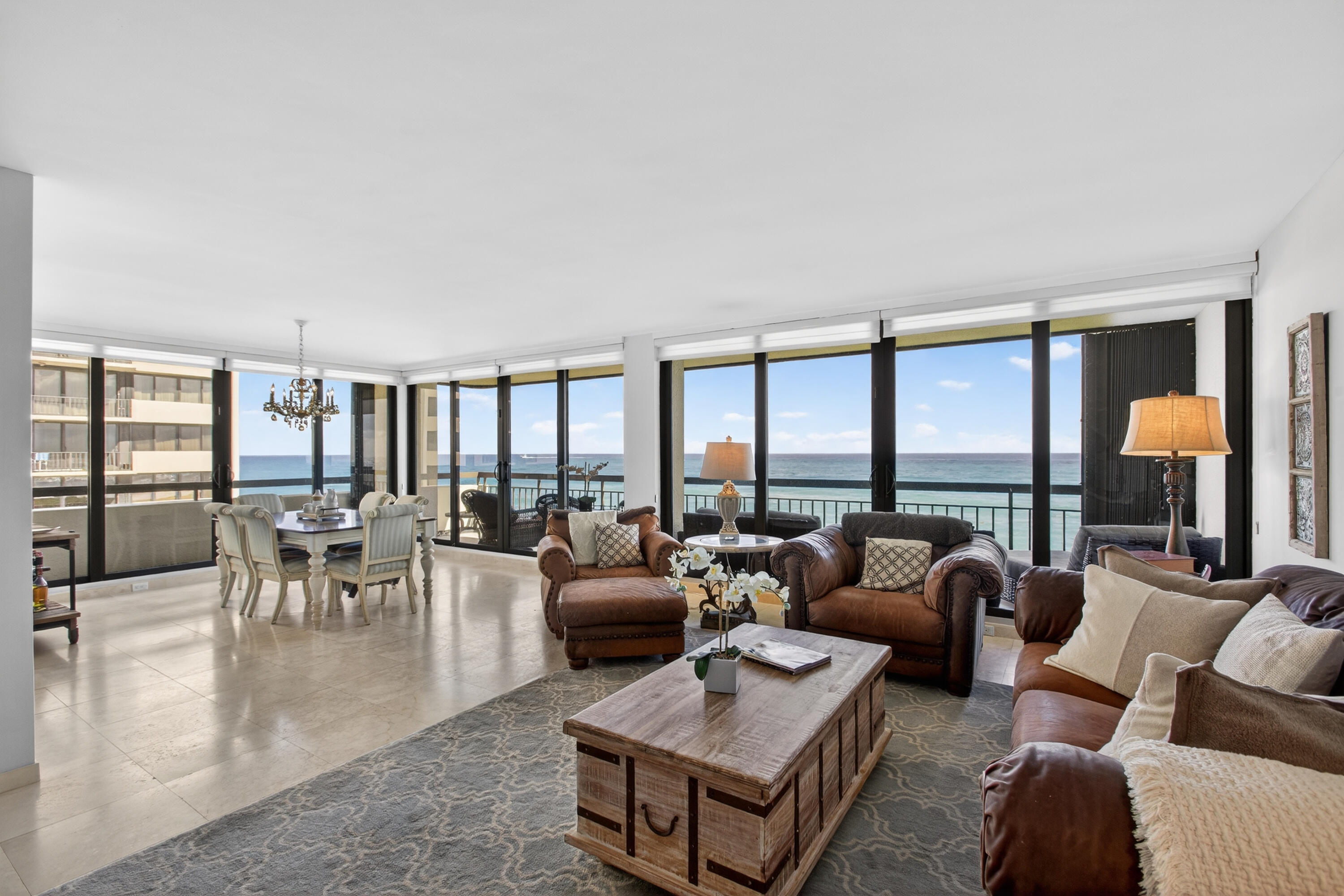 4050 North Ocean Drive, Unit 301 Riviera Beach, FL 33404 - Photo 9 of 62 a living room with furniture and a large window