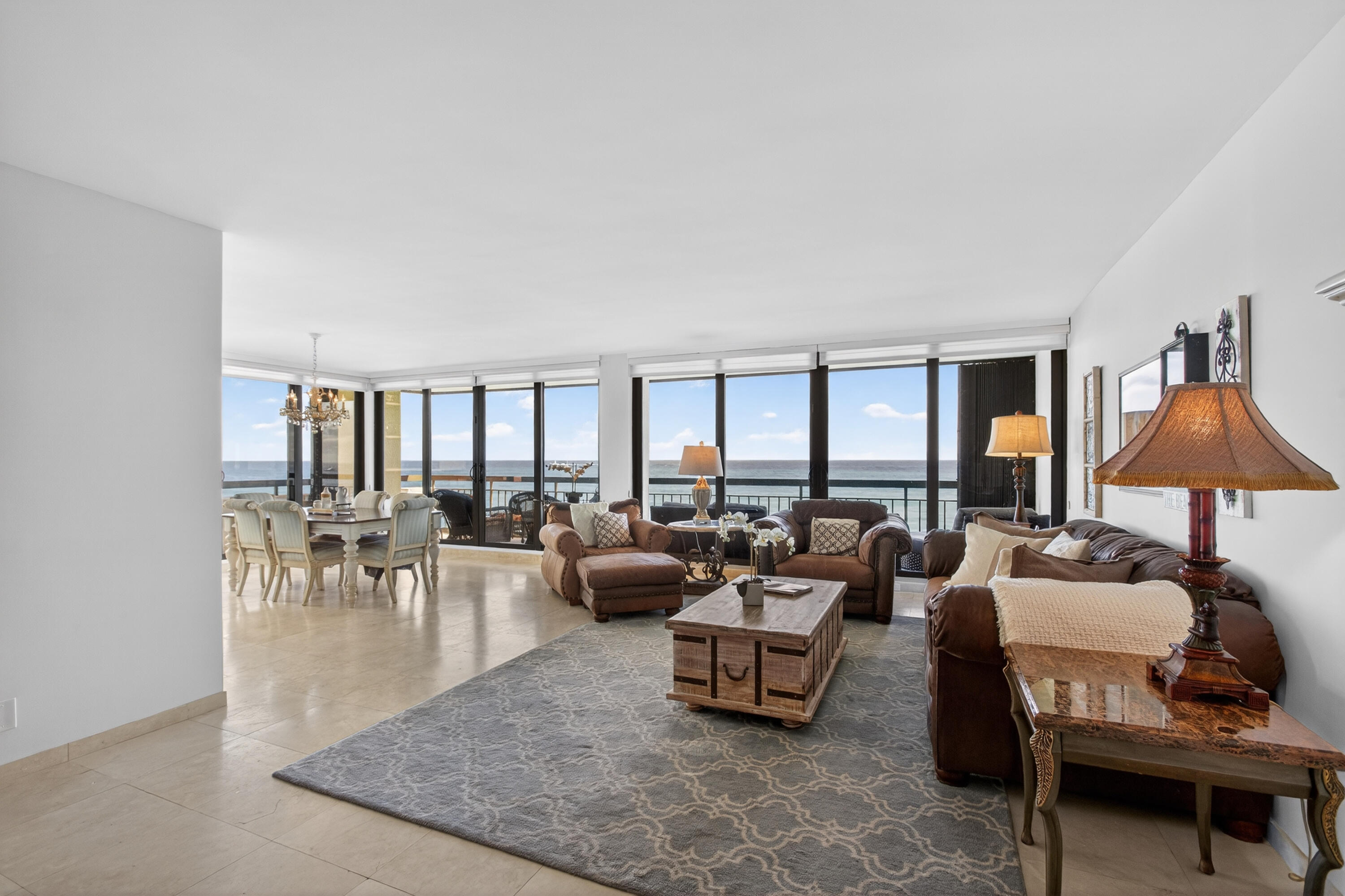 4050 North Ocean Drive, Unit 301 Riviera Beach, FL 33404 - Photo 10 of 62 a living room with furniture and a large window