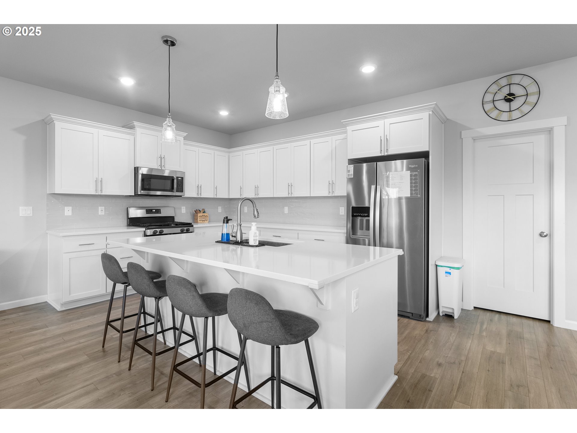 3072 Southeast 25th Street Gresham, OR 97080 - Photo 11 of 48 a kitchen with stainless steel appliances granite countertop a refrigerator a sink a stove a dining table and chairs